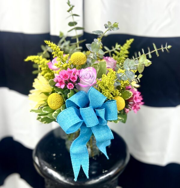 Brighten any moment with “Sunny Surprise” from Flowerland Florist in Sulphur Springs, TX. Featuring vibrant yellow roses and cheerful blooms with fresh greenery, this uplifting arrangement is perfect for birthdays, get well, or just because. Local delivery available.