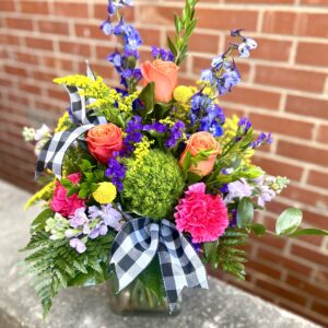 Uncover the beauty of “Garden Secrets” from Flowerland Florist in Sulphur Springs, TX. Bursting with roses, carnations, delphinium, and vibrant greenery in bold hues of pink, purple, yellow, and green—this lush arrangement is perfect for any joyful occasion. Local delivery available.