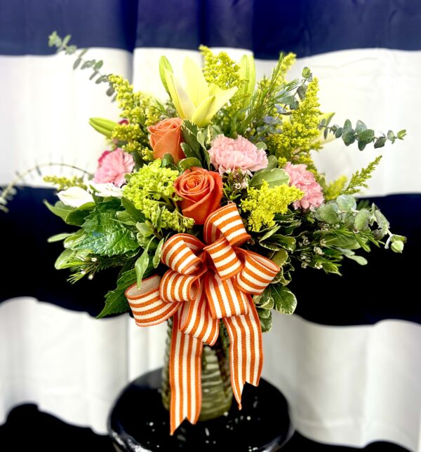 Bring warmth and whimsy with “Daydream” from Flowerland Florist in Sulphur Springs, TX. A vibrant mix of yellow and orange blooms, this cheerful arrangement is perfect for celebrating, encouraging, or simply making someone smile. Local delivery available.