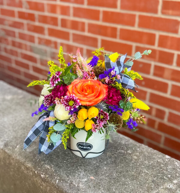 Our candle and floral combo features a beautifully designed fresh arrangement nestled on top of a premium candle—creating a unique and heartfelt gift for any occasion. Candle scents vary seasonally, making each one a little surprise! Perfect for birthdays, sympathy, thank-yous, or just because.