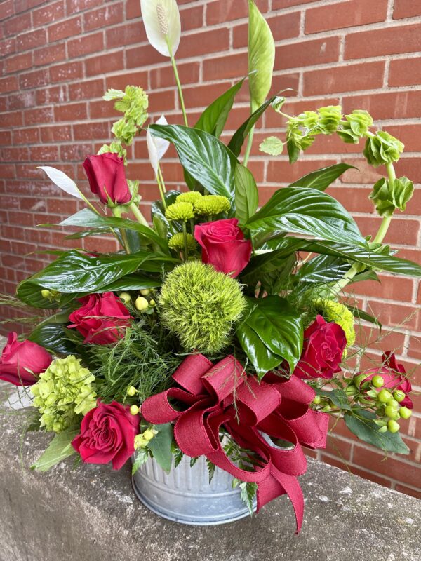 Send heartfelt sympathy with our rustic rose vase arrangement from Flowerland Florist in Sulphur Springs, TX. Featuring fresh roses in a charming rustic container—perfect for funerals, memorials, or condolence gifts. Local delivery available.