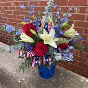 Show your American pride with this patriotic bouquet from Flowerland Florist in Sulphur Springs, TX. Featuring classic red roses, white blooms, and blue accents, it’s perfect for Memorial Day, Fourth of July, Veterans Day, or honoring a loved one. Local delivery available.
